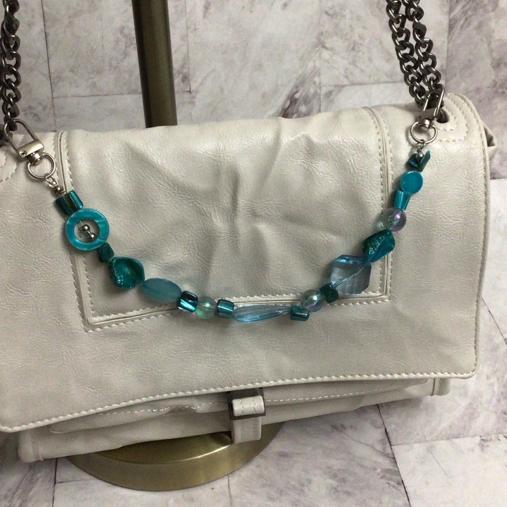 Green beaded chain bag charms.